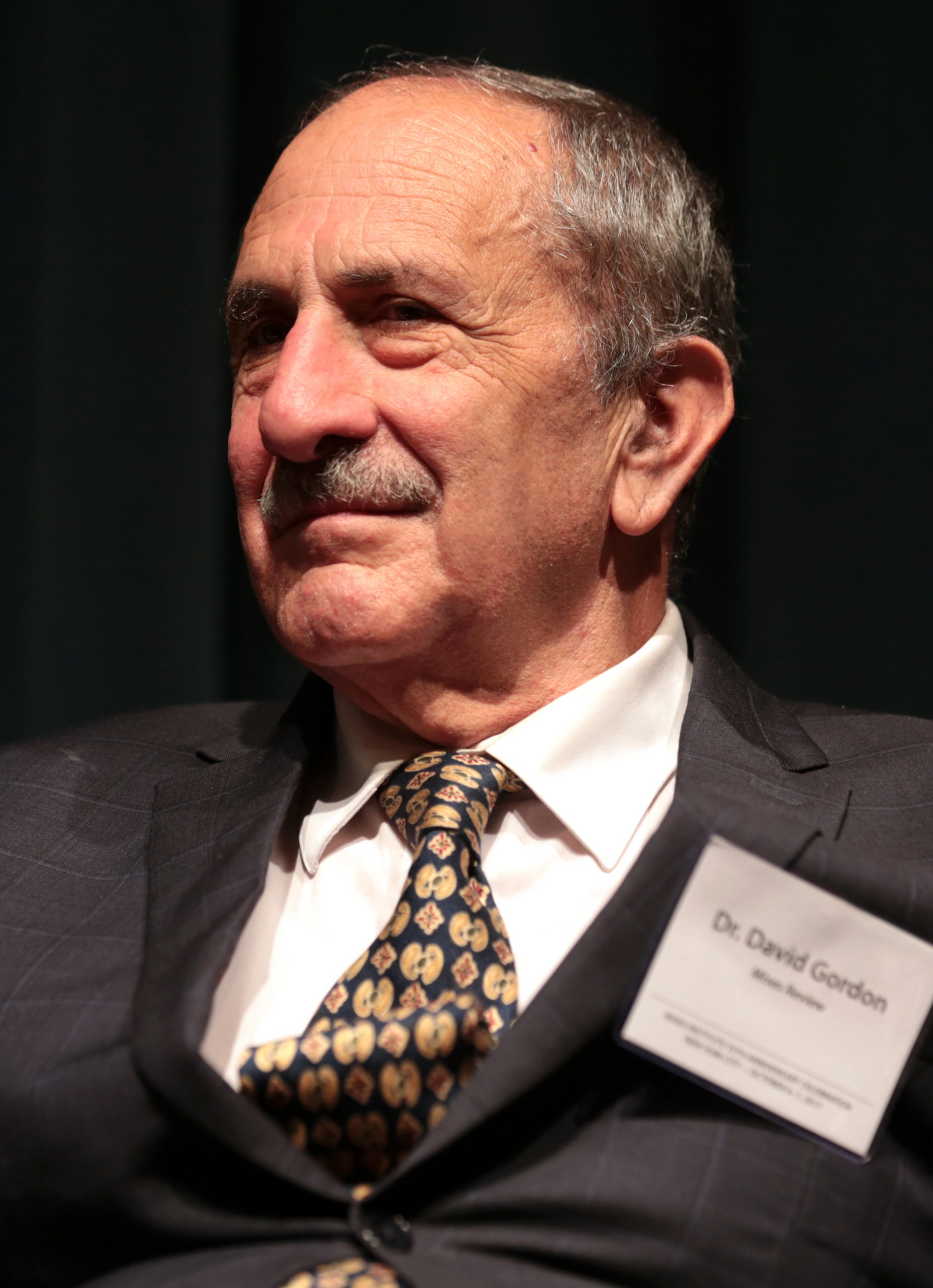 David Gordon, adjunct faculty at the Carl Menger Institute and senior fellow at the Ludwig von Mises Institute, specializes in Austrian economics and intellectual history. He holds a Ph.D. from UCLA and has authored The Philosophical Origins of Austrian Economics and Resurrecting Marx. Gordon's work explores the foundations of Austrian theory and its key figures, Mises and Rothbard.